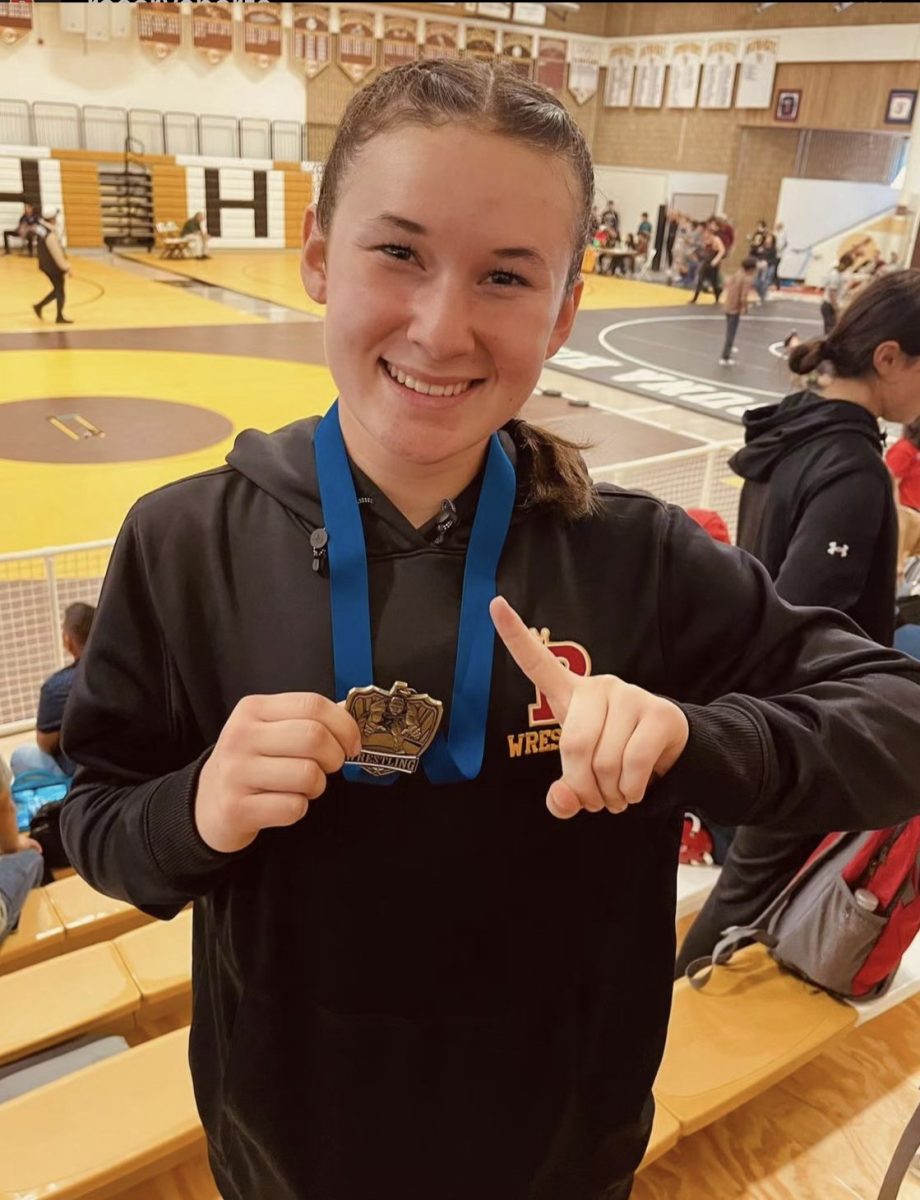 Hayden Huerta '27 poses with her first goal medal. 