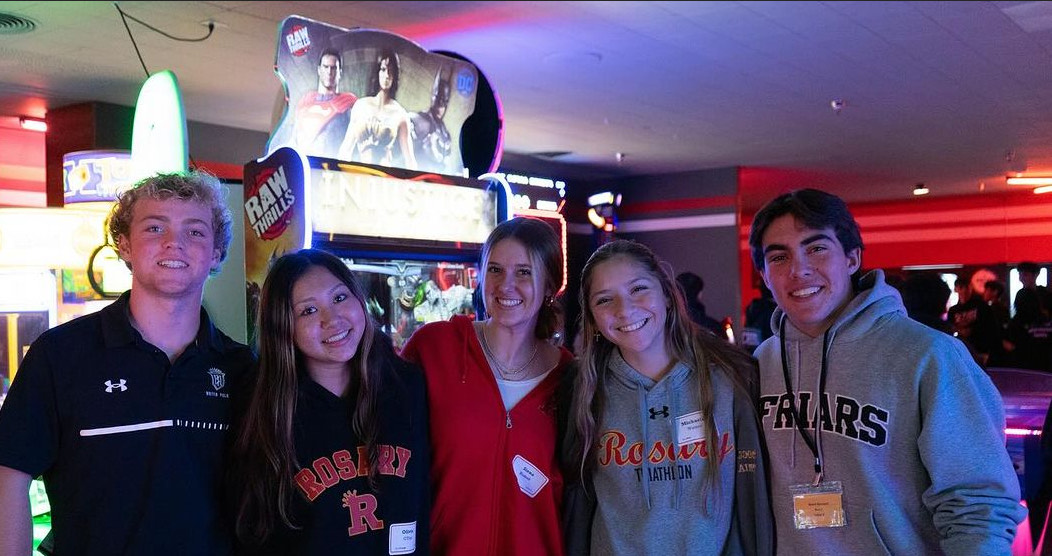 Rosary and Servite sophomores smile for a pic while bowling.