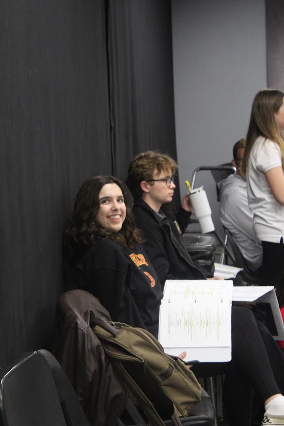 Mia Kennedy '24 and Caleb Simmons '25 are going over a scene in rehearsal.