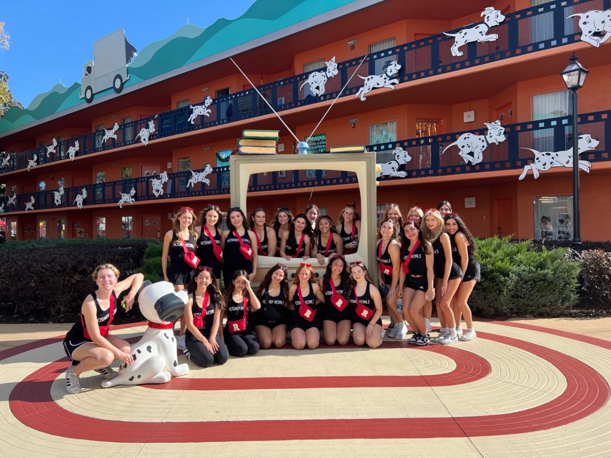 The cheer team posed next to this cute photo op at their hotel.