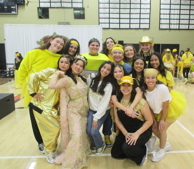 Gold seniors pose for a quick picture in the Servite gym.