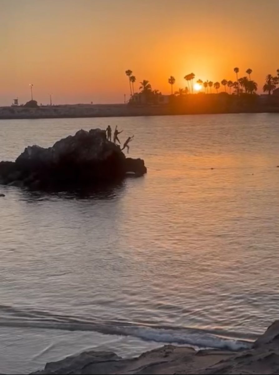 Bella Vallejo jumping off a cliff in Corona Del Mar. 