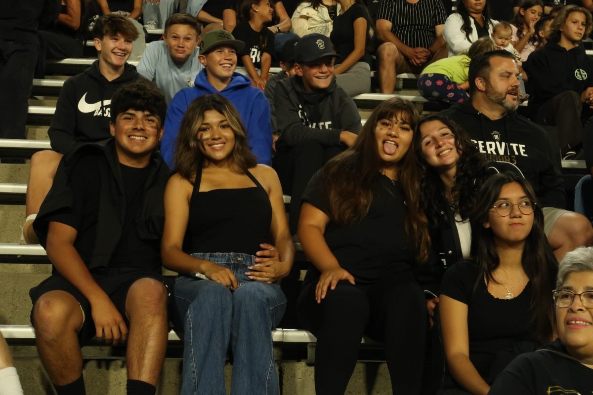 Servite and Rosary students supporting the football team at the "black out" game.