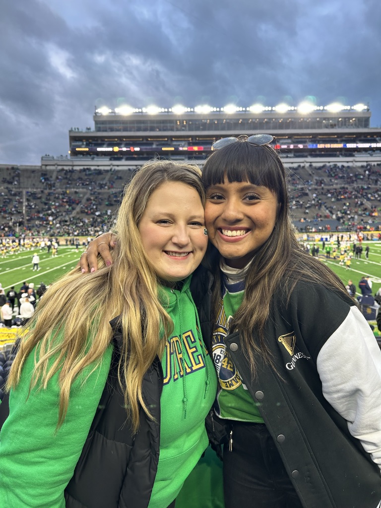 Ms. Williams is supporting the Notre Dame football team with one of her close friends!