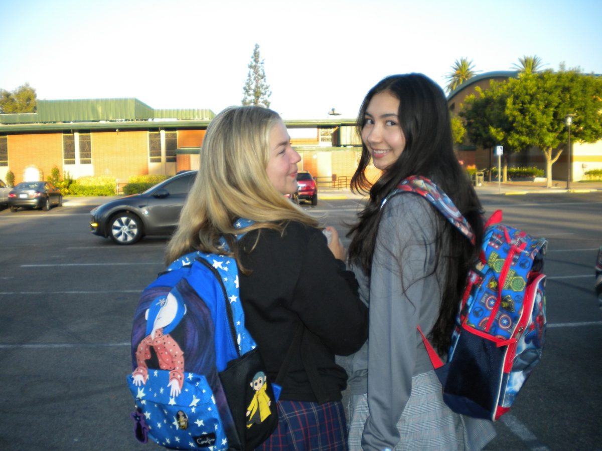 Kate Piper '25 and Nahomi Saito '25 pose with their new backpacks!