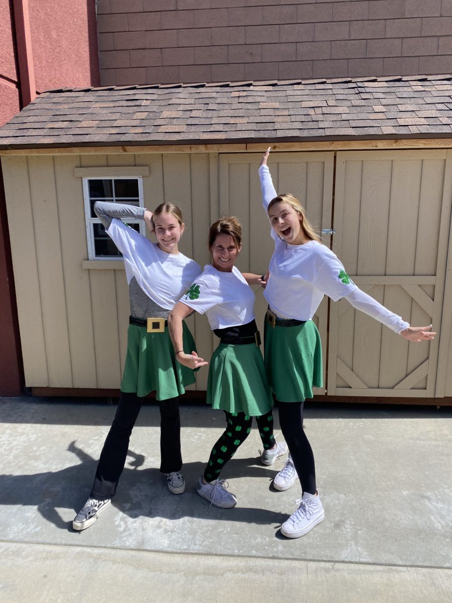 Daly '22, Evelyn '22, and Mrs. Huerta '94 posing in their costumes that never got to see the stage.