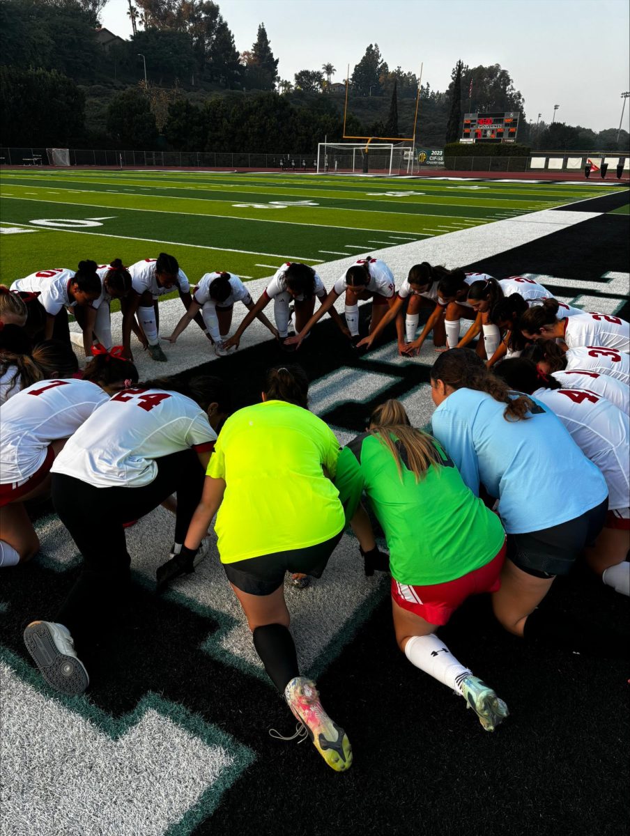 Royals host a team prayer before a big game.