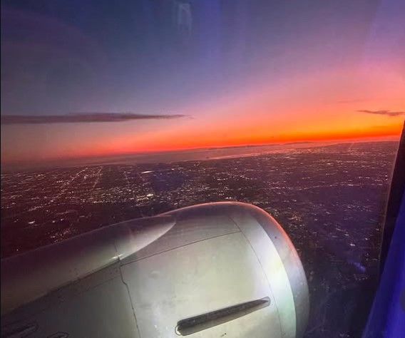 The view out of a plane window gives us a chance to look at beautiful sunsets and city lights with a different perspective. 