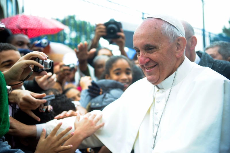 Pope Francis greets a crowd as he often did during his Papacy. 