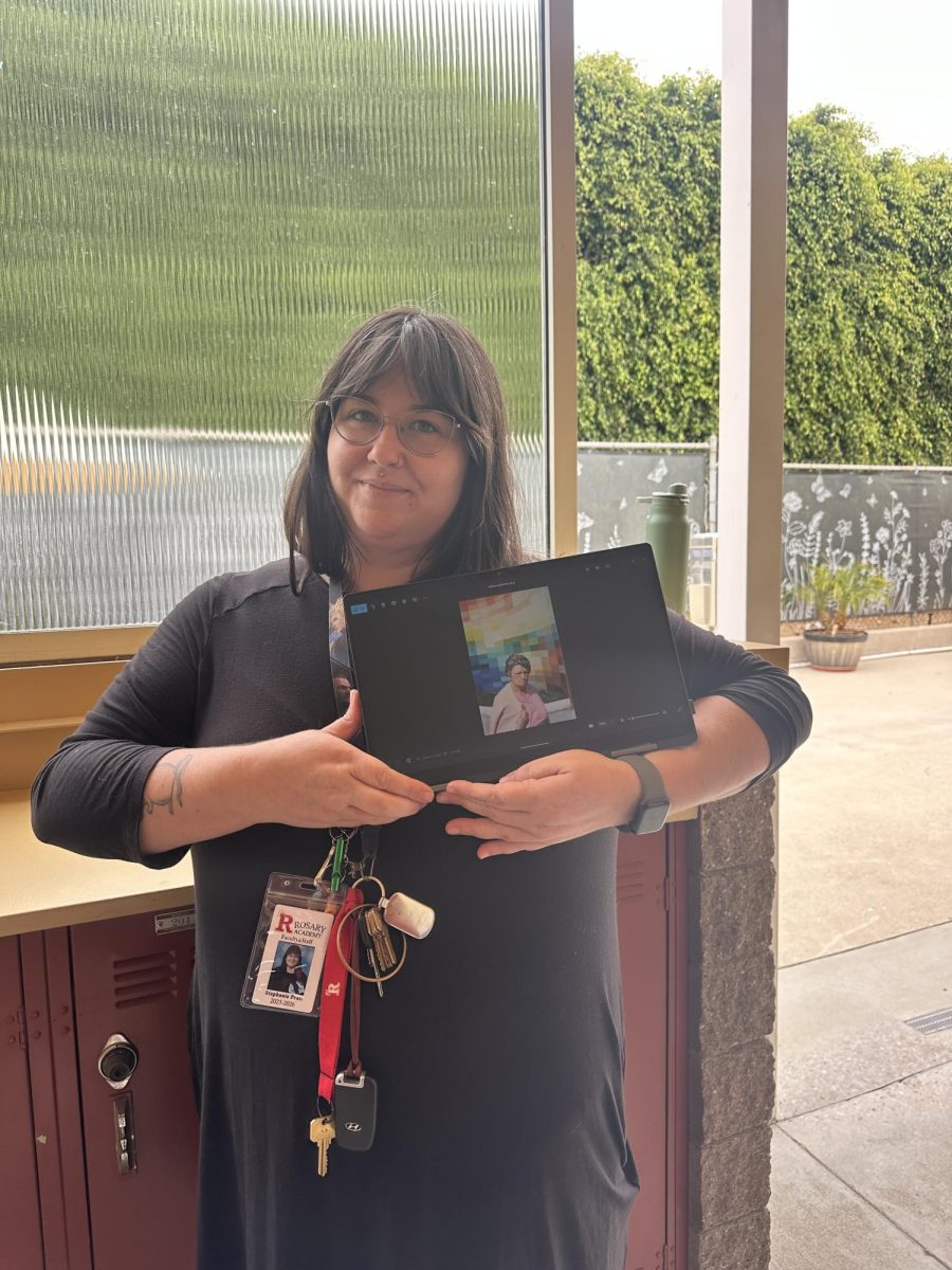 Ms. Pratt poses with one of her favorite photographs. 