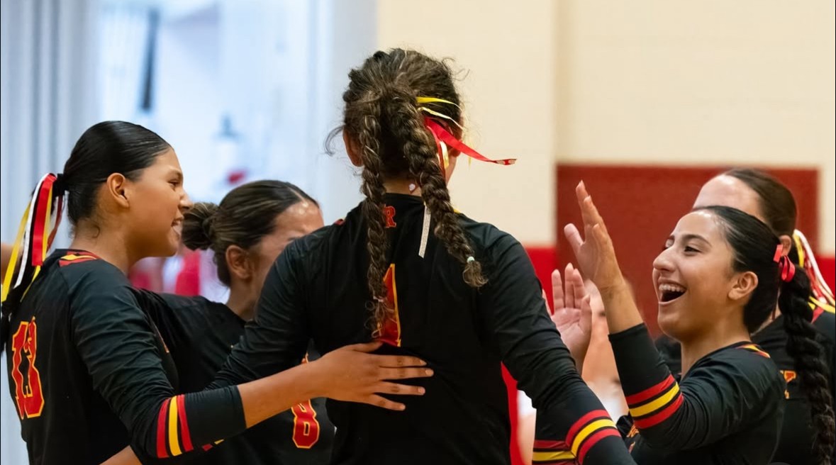 JV team members support each other through encouraging cheers!