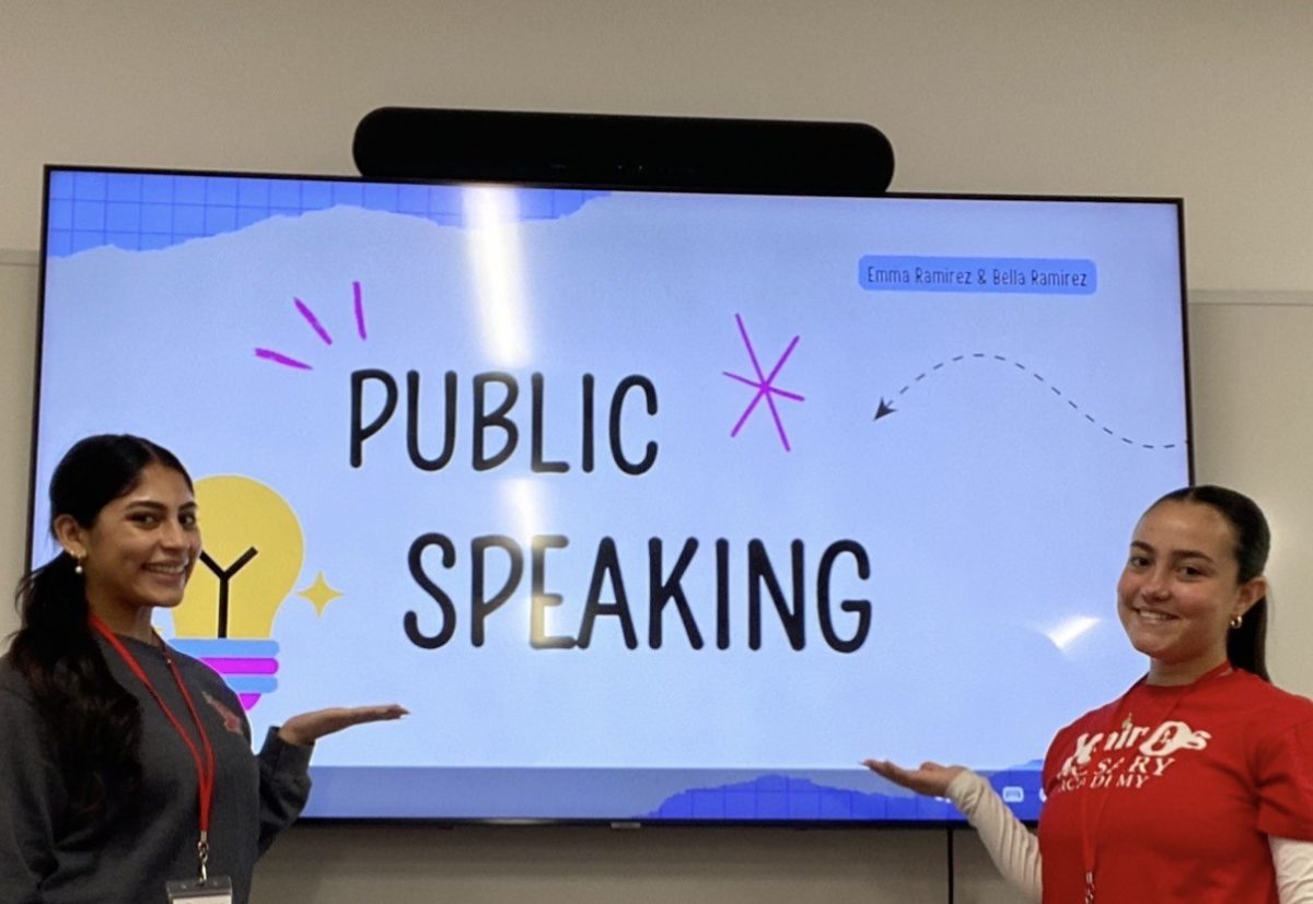 Emma Ramirez '26 proudly presents public speaking at a TACSC leadership day.